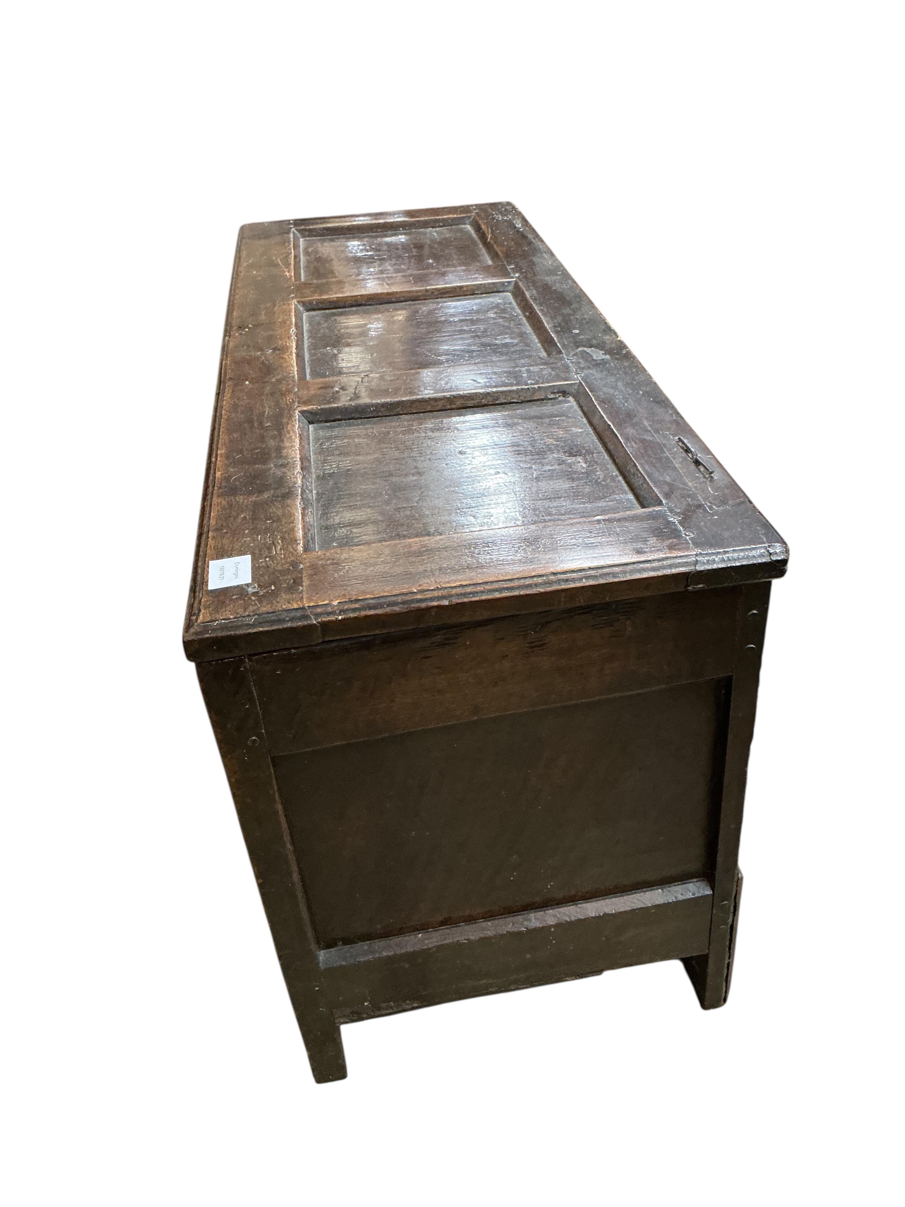 A late 17th century oak triple panelled coffer, width 116cm, depth 44cm, height 58cm
